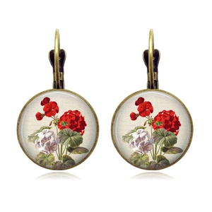 Close-up of vintage bronze rose earrings with floral glass cabochon and lever-back hooks