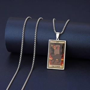 Detail of stainless steel tarot necklace with cat themed The Tower card pendant