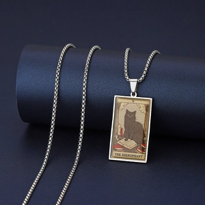 Macro detail of The Hierophant black cat tarot card pendant in silver stainless steel