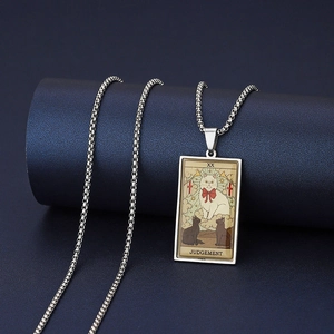 Detailed view of XX Judgement Tarot pendant with cat design on blue display stand