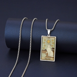 Macro detail of The Star tarot cat pendant showing intricate vintage artwork and steel chain