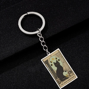 Detailed close-up of The High Priestess tarot keychain featuring a black cat design
