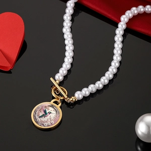 Vintage pearl necklace with hummingbird painted pendant and gold OT toggle clasp
