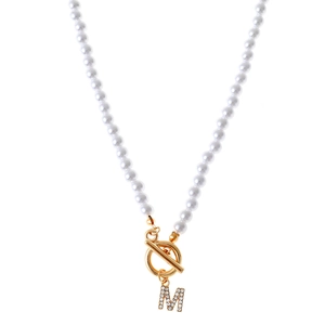 Lustrous pearl necklace featuring a gold OT buckle and a sparkling rhinestone M letter pendant