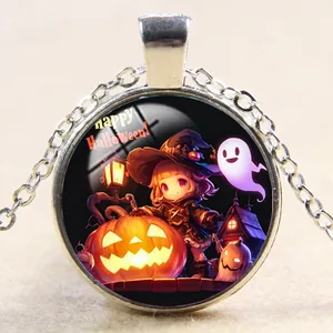 Macro shot of Halloween necklace pendant with witch and pumpkin illustration