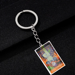 Macro detail of The Hanged Man tarot card pendant with colorful painted enamel finish