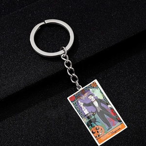 Macro detail of The Magician tarot keychain with colorful Halloween oil painting graphics