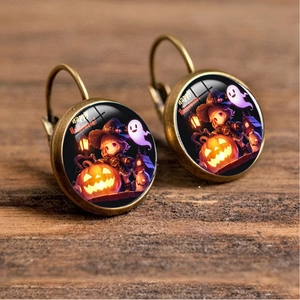 Detail of Halloween drop earrings featuring cartoon pumpkin and ghost glass cabochon art