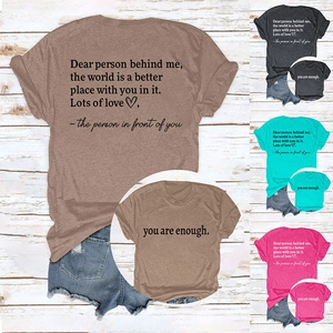 Detail of the inspirational quote You Are Enough printed on a casual cotton T-shirt pocket