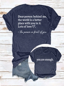 Macro shot of navy blue cotton T-shirt with inspirational text and denim shorts