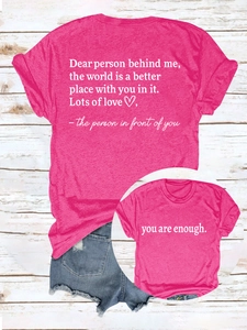 Close-up of you are enough slogan and text on rose pink short sleeve cotton t-shirt