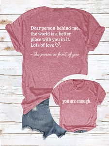 Flat lay of a red slogan t-shirt with back text and distressed blue denim shorts set