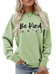 Detail of light green Be Kind sweatshirt showing ribbed crewneck and soft cotton texture