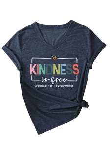 Detail of Kindness is Free print on grey V-neck tee with leopard heart and knotted hem
