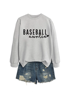 Detail of grey Baseball Auntie crewneck sweatshirt and distressed denim shorts