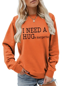 Detail of orange sweatshirt with I Need a Huge Margarita print and ribbed neckline