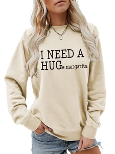 Detail of cream sweatshirt with ribbed collar and I NEED A HUGe margarita printed slogan