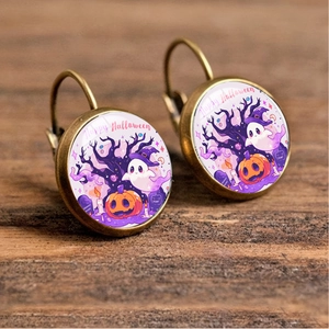 Detail of vintage bronze Halloween earrings featuring ghosts and pumpkins on wood