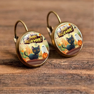 Detailed close-up of bronze Halloween earrings with ghost and pumpkin glass cabochon