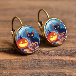 Detail of vintage bronze earrings featuring Halloween black cat and pumpkin illustration
