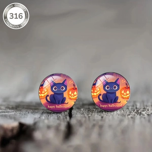 Macro detail of Halloween round stud earrings with black cat, pumpkin and glass dome