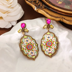 Vintage mandala painting drop earrings with pink gems in a retro golden finish