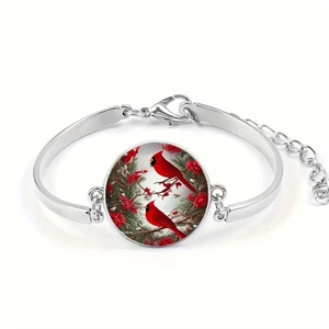 Silver bracelet featuring glass cabochon with cardinal birds on flowering branches