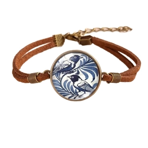 Vintage bronze hummingbird glass cabochon bracelet with blue bird patterns and brown suede cord
