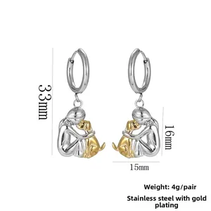 Detail of dog pendant earrings in gold and silver finish with size measurements