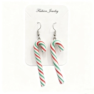Detailed view of Christmas candy cane earrings with festive red, green and white stripes