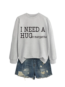 Detailed close-up of ribbed crewneck and humorous text on light gray casual sweatshirt