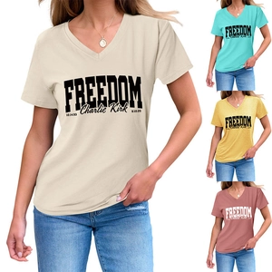 Close-up of V-neck cotton T-shirts with Freedom logo in beige, blue, yellow and red