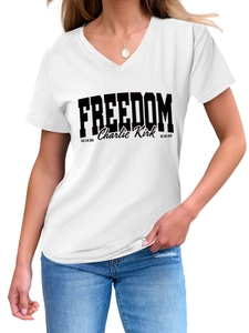Detail view of white V-neck T-shirt featuring Freedom print and Charlie Kirk signature