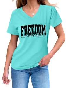 Detail of the V-neckline and bold Freedom Charlie Kirk print on turquoise women's t-shirt