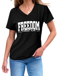 Detail of V-neck black cotton T-shirt featuring white Freedom text and Charlie Kirk signature