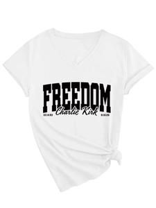 Detail of white V-neck T-shirt with Freedom Charlie Kirk graphic and stylish side knot