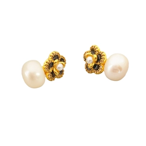 Elegant gold flower earrings with black enamel and white freshwater pearls on white background