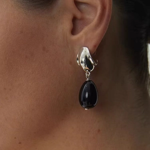 French style silver drop earrings featuring liquid metal waves and black onyx pendants