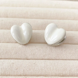 Minimalist cream white heart hoop earrings with glossy enamel and silver metal base