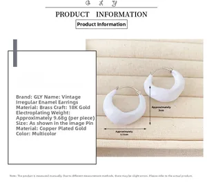 Detailed view of vintage irregular white enamel earrings with 18K gold plated brass