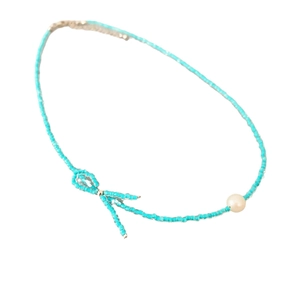 Minimalist sky blue beaded necklace with bow design and white cultured pearl accent