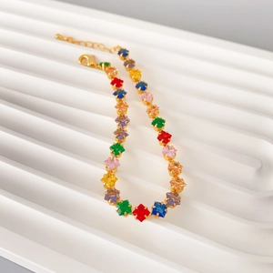 Exquisite 18K gold plated bracelet with colorful square-cut crystals on a white pedestal