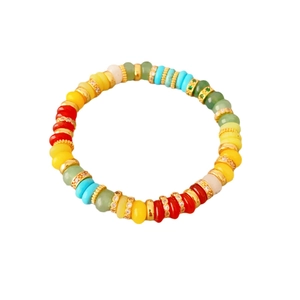 Rainbow gemstone beaded bracelet with gold rhinestone spacers on white background