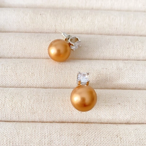 Champagne pearl stud earrings with sparkling cubic zirconia on silver metal base