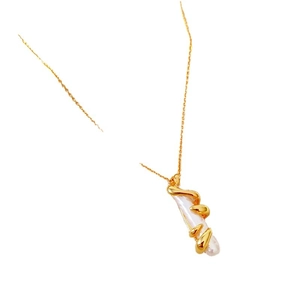 French vintage baroque pearl necklace with gold liquid metal style pendant on white background