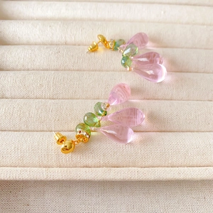 Pastel pink quartz glass teardrop earrings with green beads and gold-plated finish