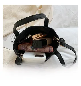Interior view showing the large capacity of the black pebbled leather bucket bag