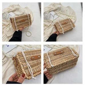 Close-up of woven rattan bag featuring elegant pearl strap and white drawstring lining