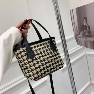 Classic houndstooth pattern tote bag with dual handles and adjustable shoulder strap