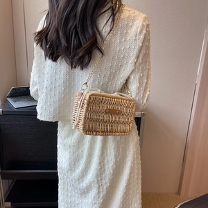Handmade rectangular rattan crossbody bag with gold chain strap for beach vacations